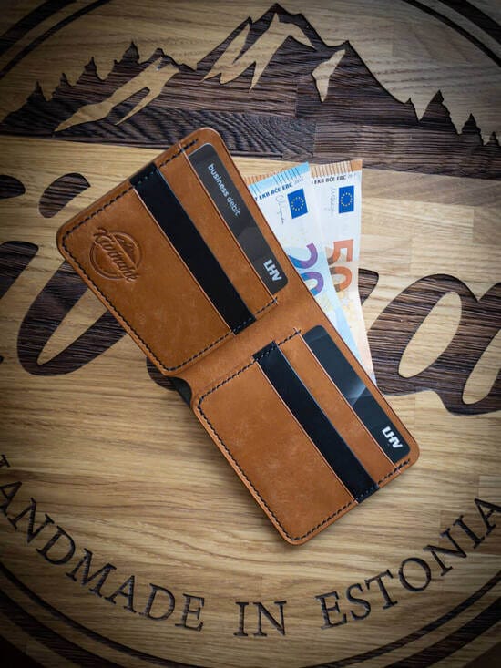 Handmade minimalist black and almond brown vegetable tanned leather bifold wallet for cash and cards