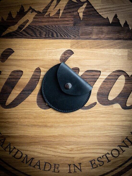 handmade black vegetable tanned leather coin pouch with a snap closure