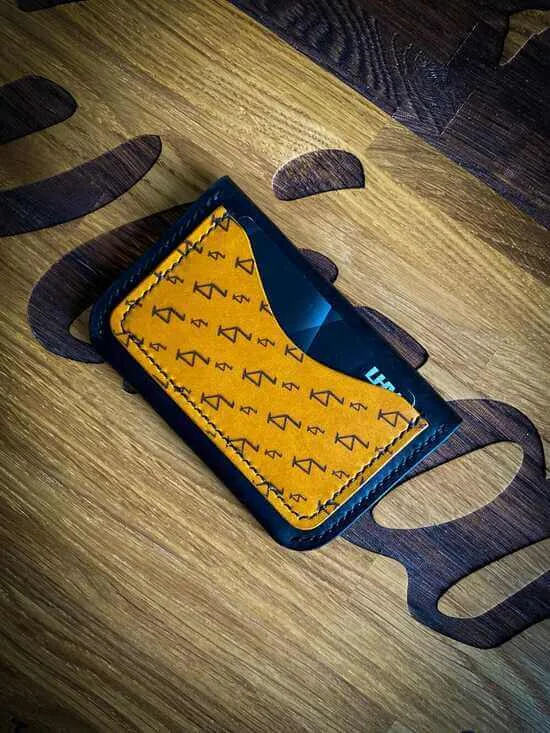 Handmade black and yellow vegetable tanned leather card wallet with laser engraved pattern
