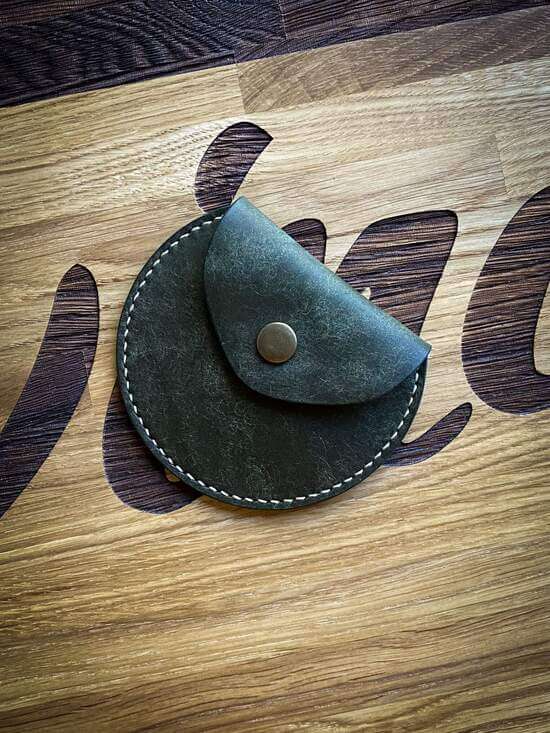Handmade green vegetable tanned leather coin pouch with a snap closure