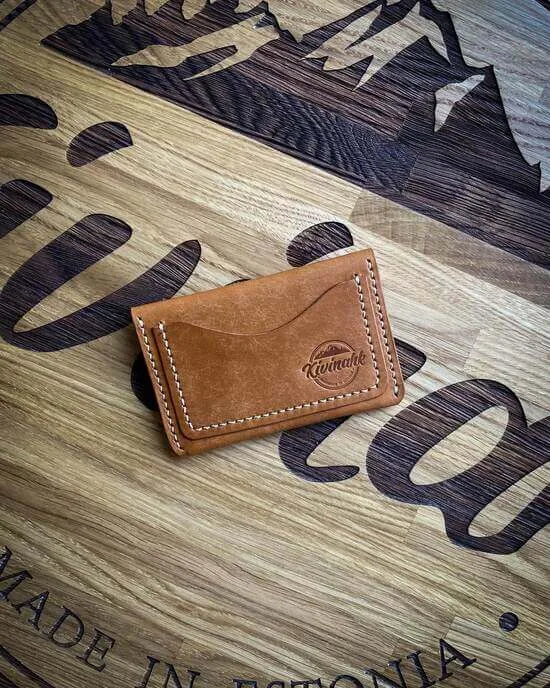 Handmade almond brown vegetable tanned leather card wallet with a flap closure