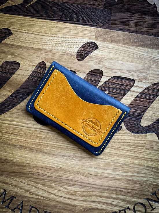 handmade blue and yellow vegetable tanned leather card wallet with flap closure
