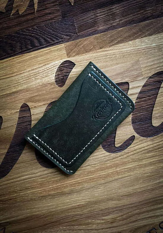 Handmade vegetable tanned leather card wallet in green color with flap closure