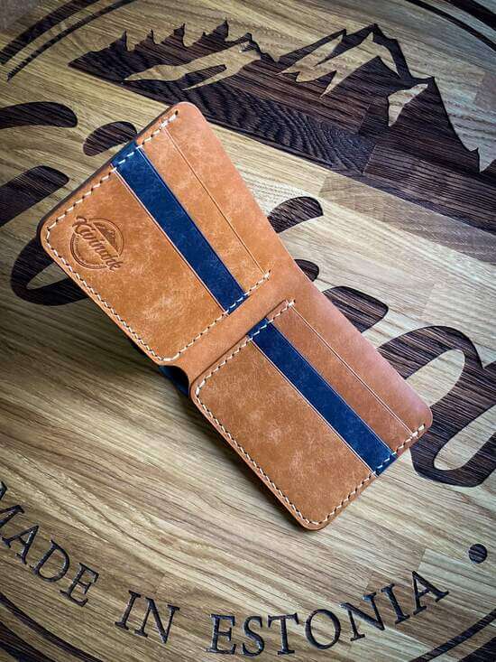 Handmade minimalist vegetable tanned leather bifold wallet in blue and almond brown colors